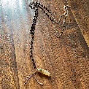 Black glass bead and gold toned